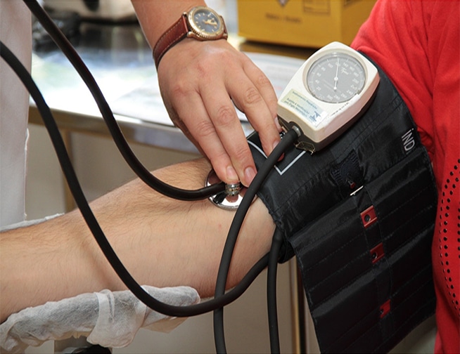 Close-up of a blood pressure monitor displaying elevated readings - a visual representation of hypertension.