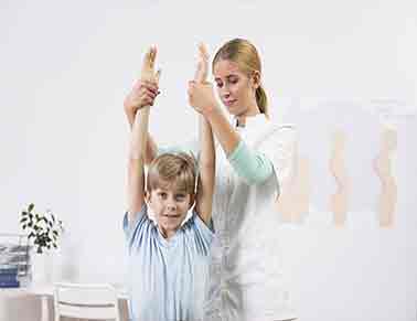 A young athlete undergoing a sports physical examination with a healthcare professional.